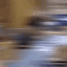 a blurry picture of a person walking on a street .
