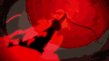 a silhouette of a person holding a sword in a red light