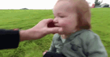 Wiping Nose Cleaning Nose GIF - Wiping Nose Cleaning Nose Daddy And Son GIFs