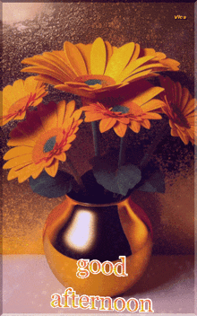 a picture of flowers in a vase with the words good afternoon on it