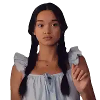 a girl with pigtails is wearing a light blue dress