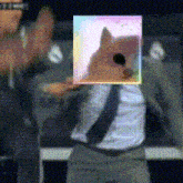 a man in a suit and tie with a picture of a doge on his face