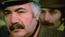 a man with a mustache wearing a hat with a dollar sign