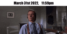 a man wearing headphones sits at a desk with his eyes closed on march 31st 2022 at 11:59 pm