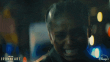 a close up of a man 's face with the words ironheart on the bottom right