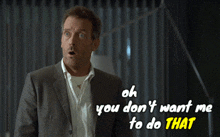 a man in a suit stands in front of a sign that says oh you don 't want me to do that