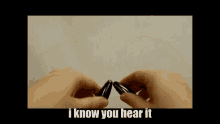 a person is holding a pair of ear plugs with the words i know you hear it written below them