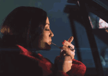 Lighting A Cigarette Lux Lyall GIF - Lighting A Cigarette Lux Lyall Baby Is A Vamp GIFs