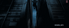 a man wearing sunglasses and a leather jacket with devara_gifs written on the bottom