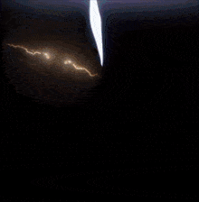 a lightning bolt is coming down a dark cliff