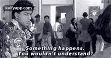 a man is standing in front of a crowd of people and saying `` something happens , you wouldn 't understand . ''
