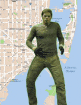 a man is standing in front of a map with biscayne bay in the background