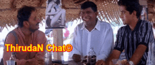 a group of men are sitting at a table with the words thiruda chat on the bottom