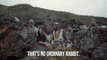 a group of knights sitting in a cave with the words that 's no ordinary rabbit on the bottom
