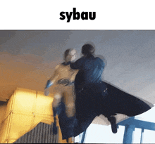 a man in a superhero costume is being attacked by another man in a cape