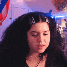 a girl wearing headphones with a sign that says shag on it