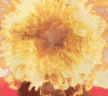 a pixelated image of a large explosion with lots of flames coming out of it .