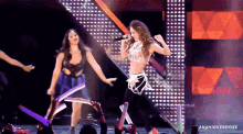 a woman singing into a microphone on a stage with the word anahioverdose on the bottom
