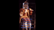 a man dressed as a king is sitting on a throne