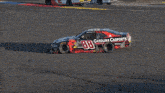 a race car is burning rubber on a track and smoke is coming out of the tire