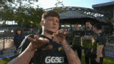 a man wearing a shirt that says ggbet