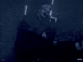 a man singing into a microphone with the word vevo in the lower right corner