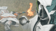 a person in a white and green costume is holding a sword with a flame coming out of it