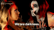 two women are standing next to each other with the words " we are darkness " written on the bottom