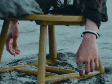 a person is sitting on a chair in the water