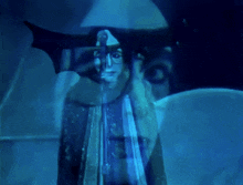 a painting of a woman 's face with a blue background