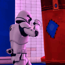 a storm trooper stands in front of a red bag with a blue patch on it
