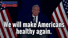 a man giving a speech in front of an american flag with the words " we will make americans healthy again "