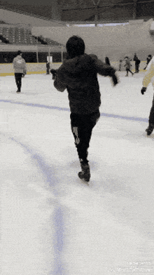a group of people are ice skating on a rink with the words made with videoshow at the bottom