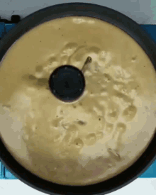 a pan of food with a black lid on top