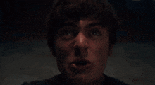 a close up of a person with their mouth open