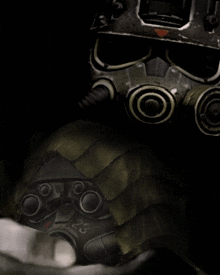 a close up of a person wearing a gas mask with the number 32 on it