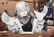 a girl with white hair is sitting at a table with a book