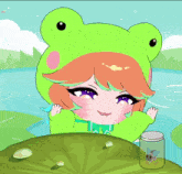 a girl in a frog costume sits next to a jar with a fly in it