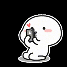 a cartoon character is holding a cell phone with a heart on his forehead .