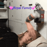 a woman is laying on a bed with the words royal family written above her