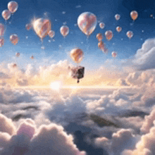 a bunch of hot air balloons are flying in the sky above the clouds