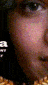 a close up of a person 's face with the letter a on the shirt