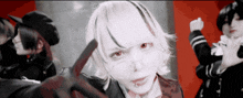 a girl with white hair and red eyes holds a knife in her hand