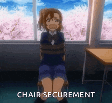 a girl is tied up and sitting in a chair in front of a window with the words `` chair securement '' .