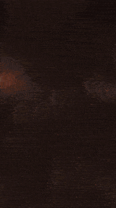 a large explosion is visible in the dark