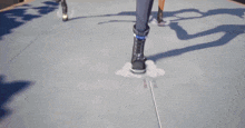 a close up of a person 's foot wearing black boots