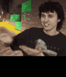 a man in a black shirt with a picture of a bird on it
