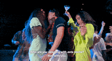 a group of people are dancing and one of them is holding a martini