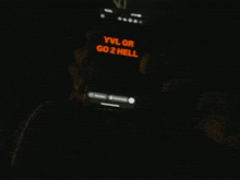 a person is holding a phone that says yvl or go2 hell
