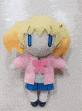a stuffed doll with pika art on the bottom right